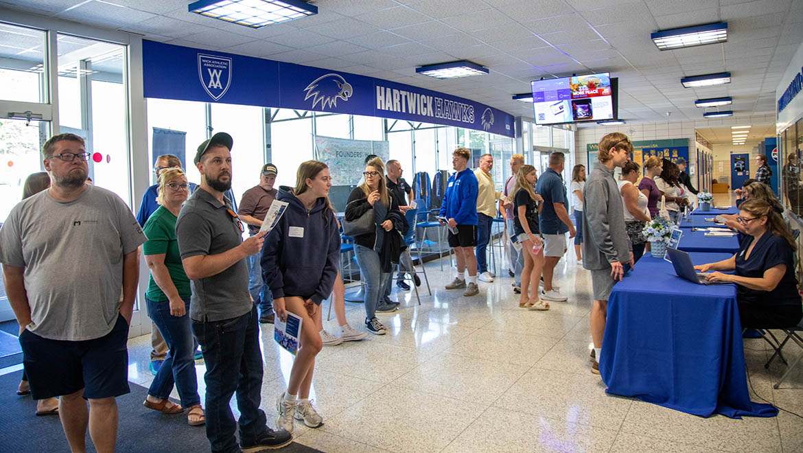 New students and families check in at Lambros Arena for Summer Orientation