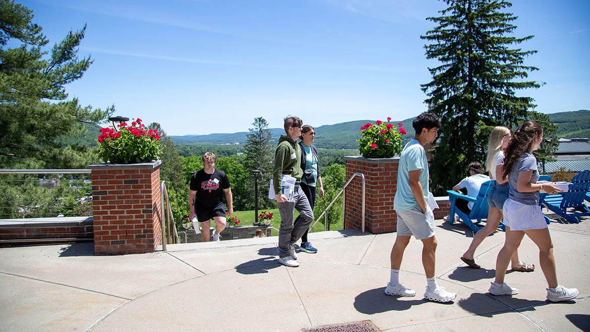 Hartwick new students walking on Founders' Way on campus during Summer Orientation
