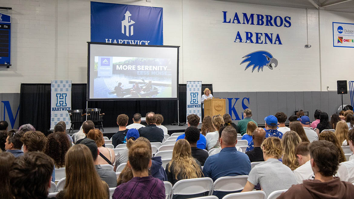 Hartwick College new students and families listening to opening session at Summer Orientation in Lambros Arena