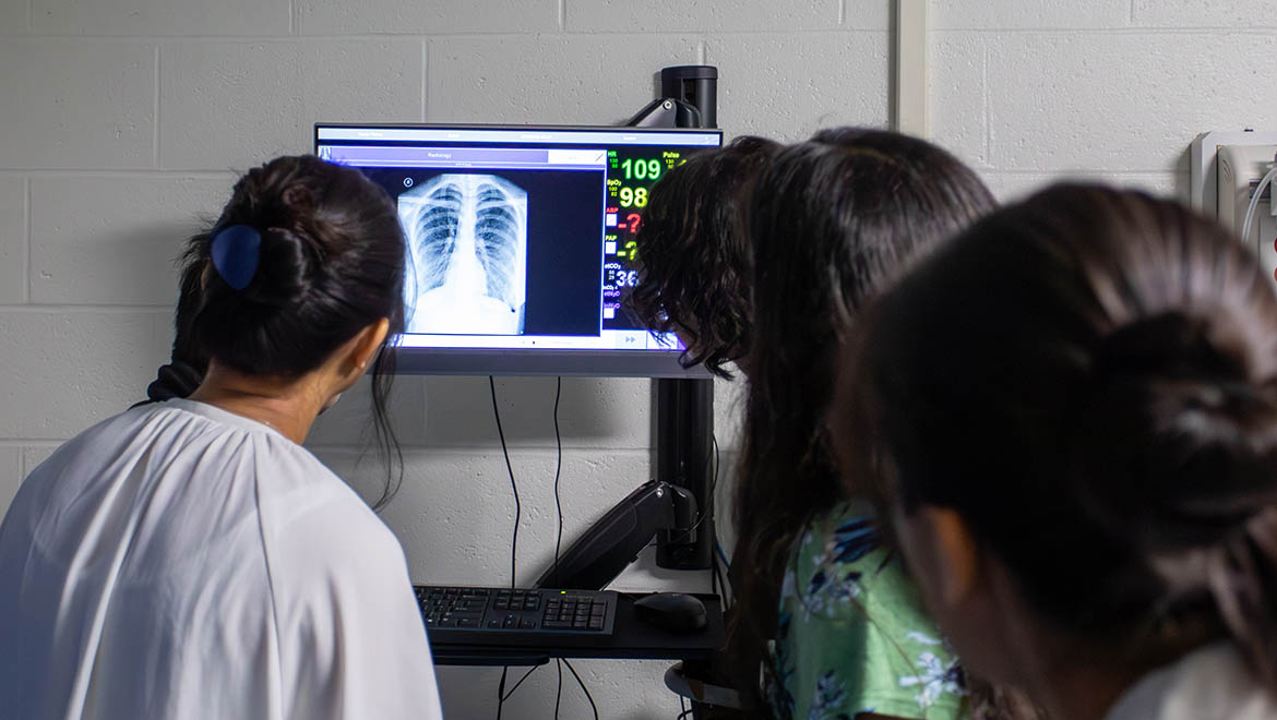 Bassett Healthcare Network professionals and resident physicians review x-ray in Brent R. Nicklas School of Nursing simulation lab