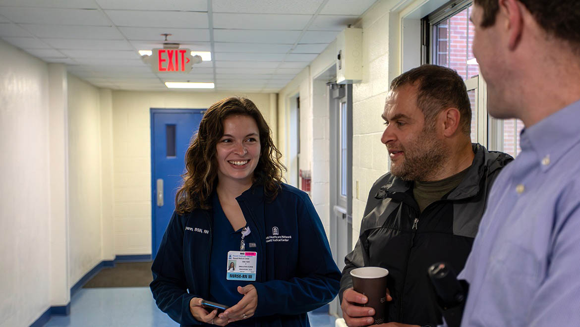 Bassett Healthcare Network clinical simulation educator and Hartwick alumna Emilyann Feldman ’21 talking with colleagues during simulation break time