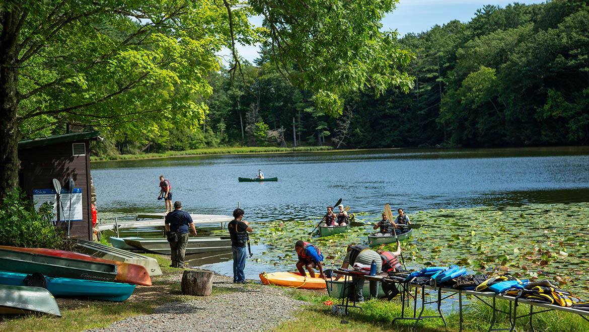 Pine Lake visitors at waterfront using boats